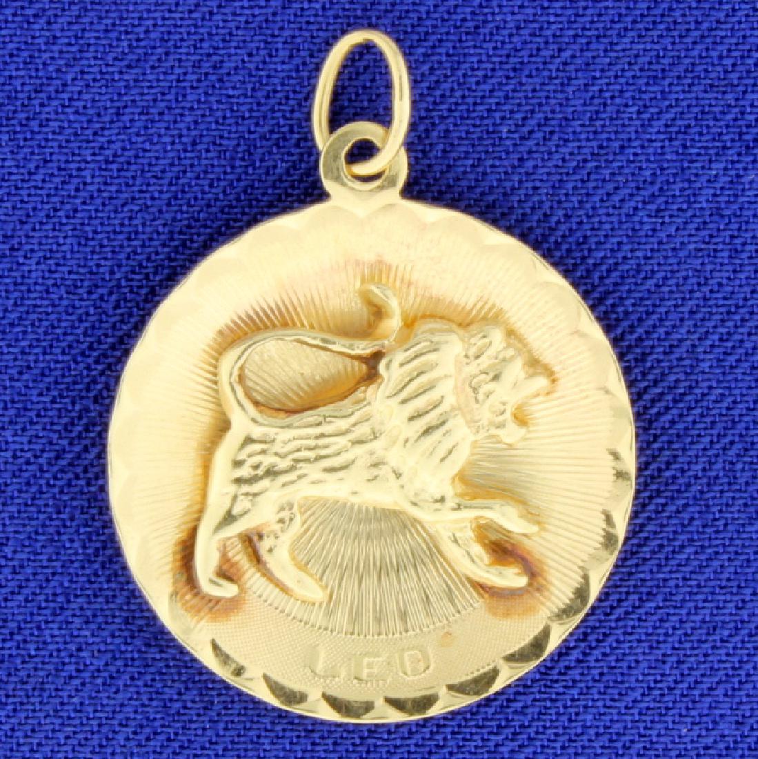 Leo Pendant: 14K yellow gold, it is 1 inch long. 3.6g
