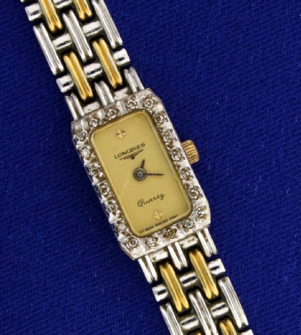Vintage Longines Diamond Two Toned Woman's Watch: Gold plated, containing twenty diamonds around bezel. Small scratch on crystal, normal for age. Swiss Quartz movement runs great, new battery.