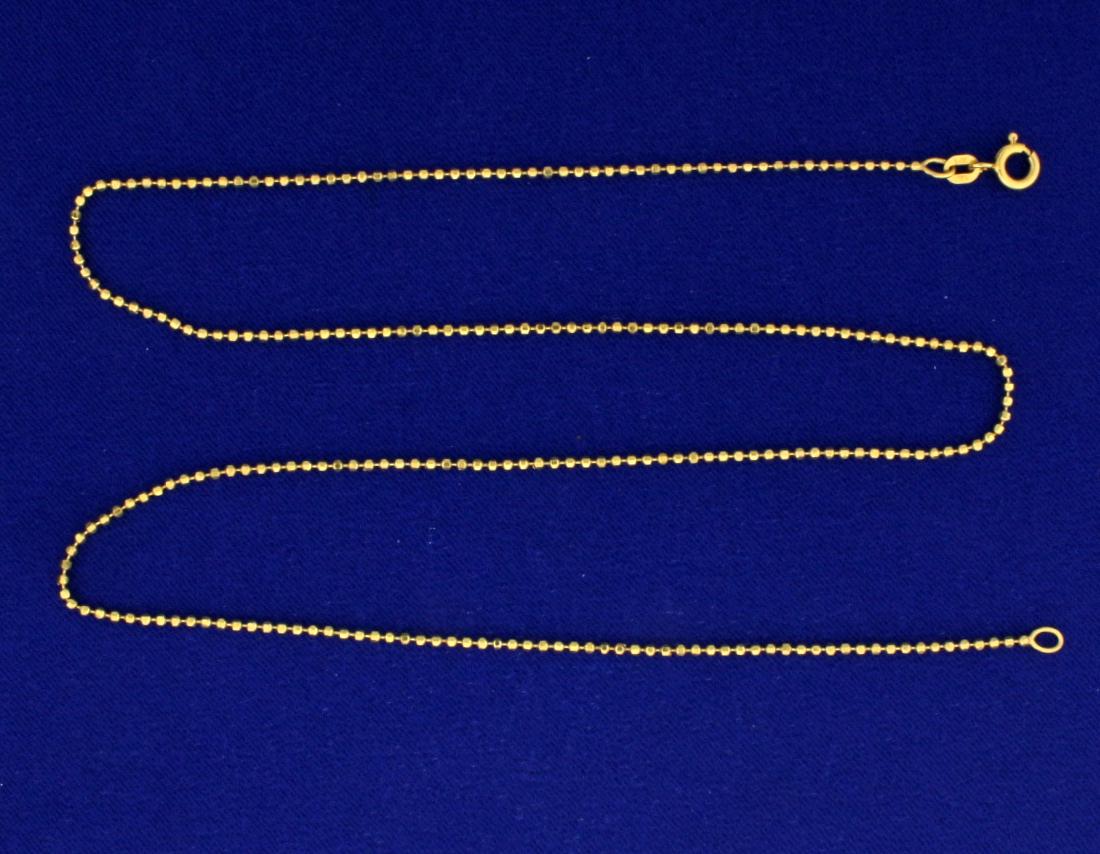 20 Inch Ball Link Chain: In 14k yellow gold. 1.5mm wide. 4.2g.