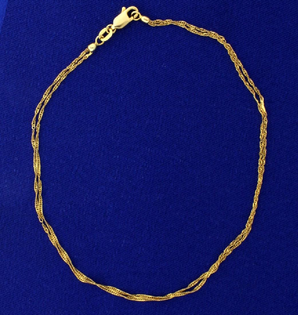 Italian Made Double Strand Gold Rope Anklet: In 14k yellow gold, 10 1/8 inches long with lobster clasp. Italian made. Each strand is 1mm thick. 1.8g.