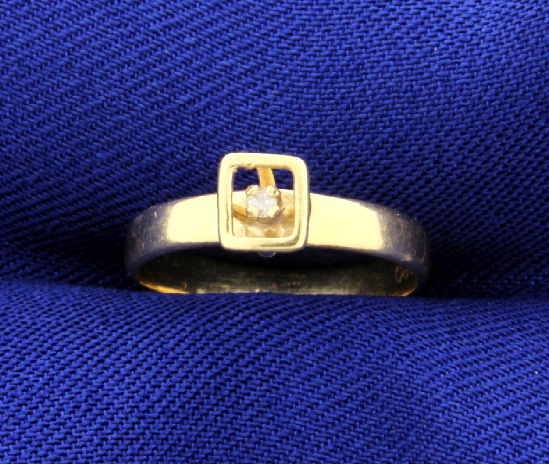 Diamond Solitaire Ring: In 14K yellow gold, the .02ct diamond has a unique setting around it. Size 4 1/4 1.4g