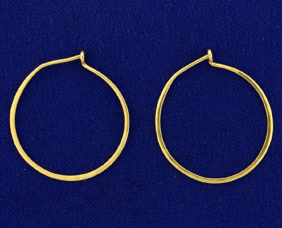 1 Inch Hoop Earrings: In 14k yellow gold. 1" long. 1.3g.