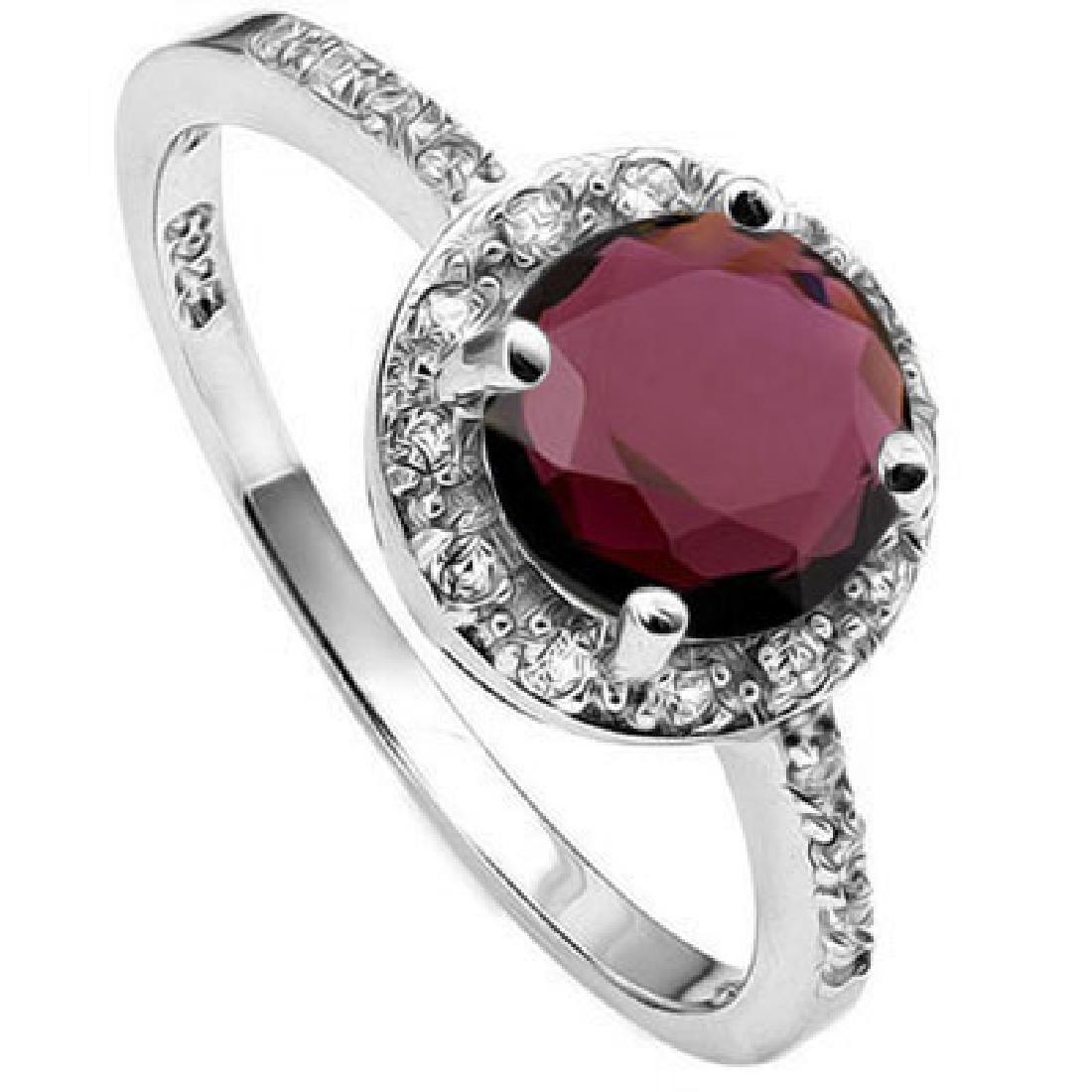 Garnet Halo Inspired Ring in Sterling Silver: Large 7mm genuine Garnet gemstone is set in a halo inspired Platinum over Sterling Silver mounting with sparkling czs for a classic look. Size 8. 2.1g