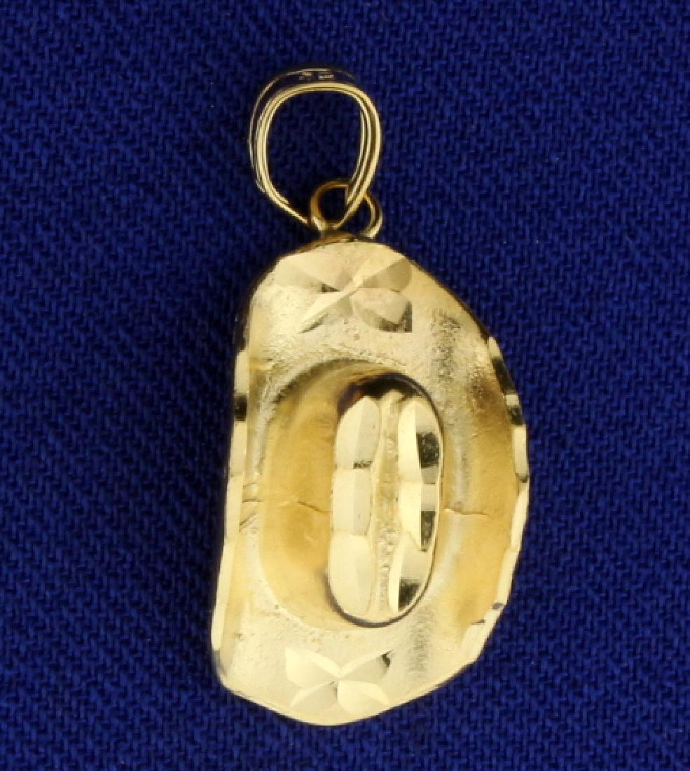 Cowboy Hat Pendant/Charm: In 14k yellow gold. 1" long with bale. 2.9g.
