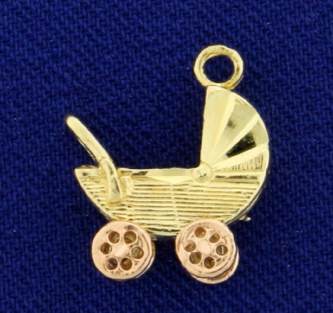 Baby Carriage or Stroller Charm in 14k Yellow and Rose: In 14k yellow and rose gold, 1/2 inch long with spinning wheels. 1.5g.
