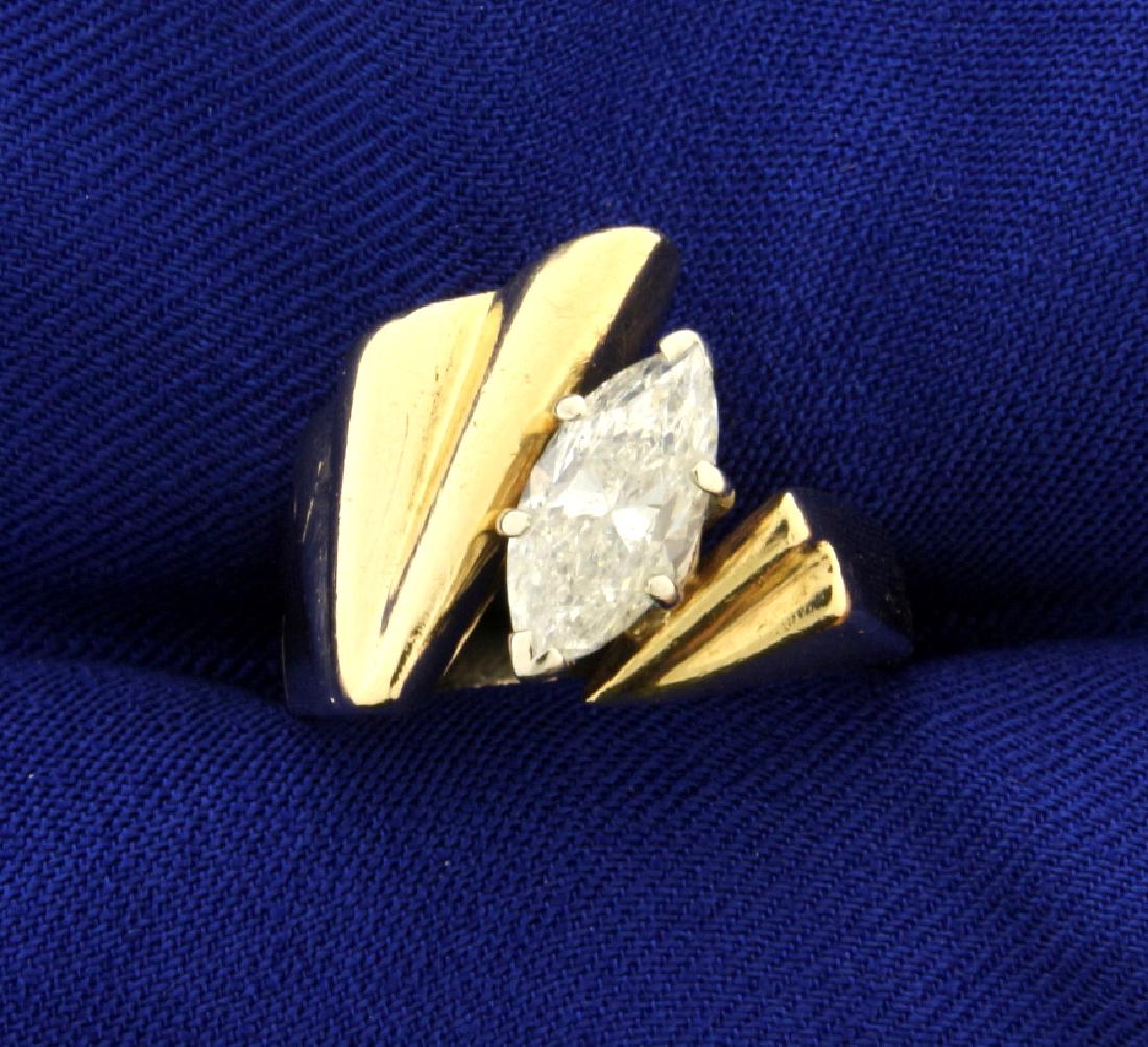 1 1/2ct Marquise Diamond Solitaire Ring: In 14k yellow gold this ring has a 1 1/2ct marquise shape diamond with I1 clarity/ K color. Set in stylish modern mounting. Size 7 9.8g