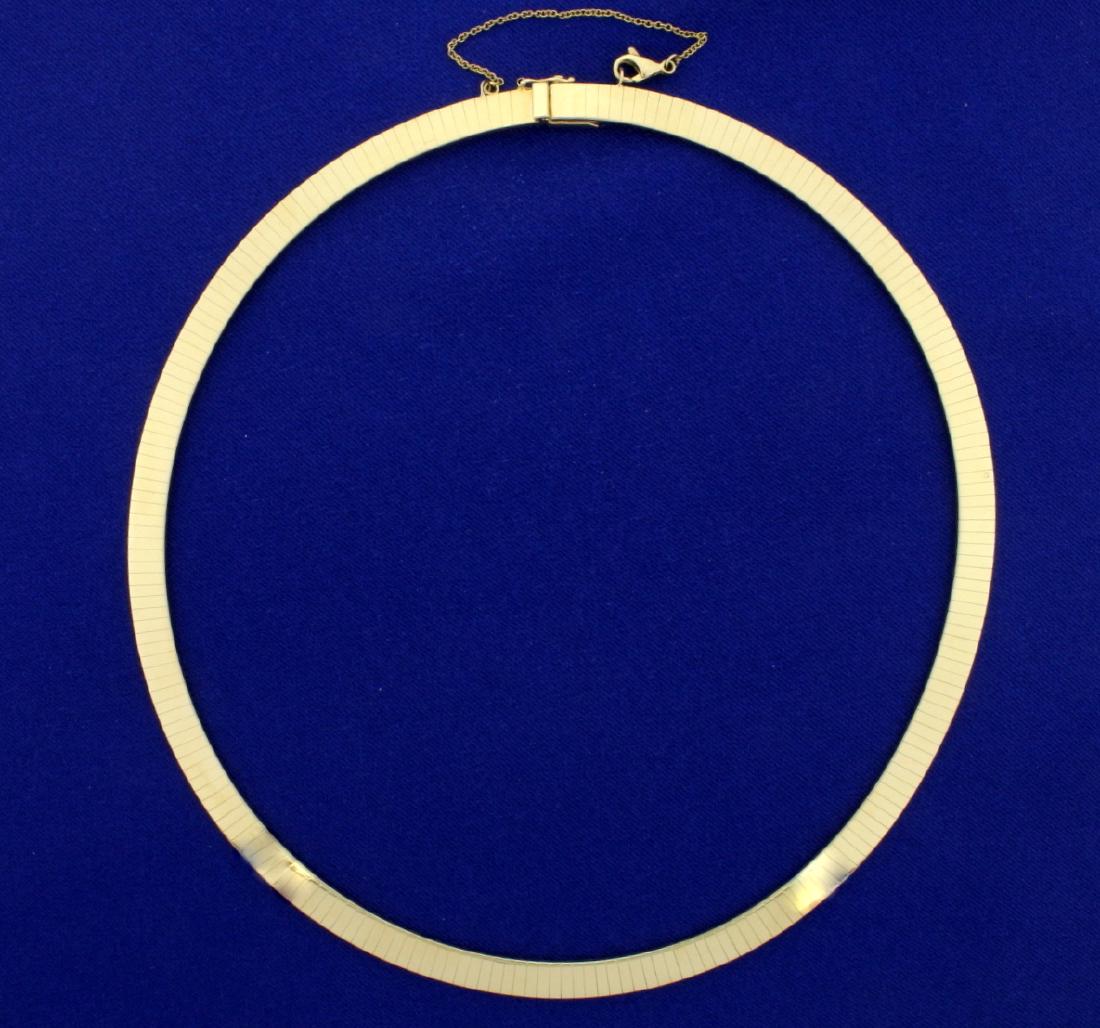 Italian Made 6mm Wide Omega Necklace in 14k Yellow Gold: 14k yellow gold and stamped “Italy”. 16” long and 6mm wide with safety chain and safety clasp. 40.9g