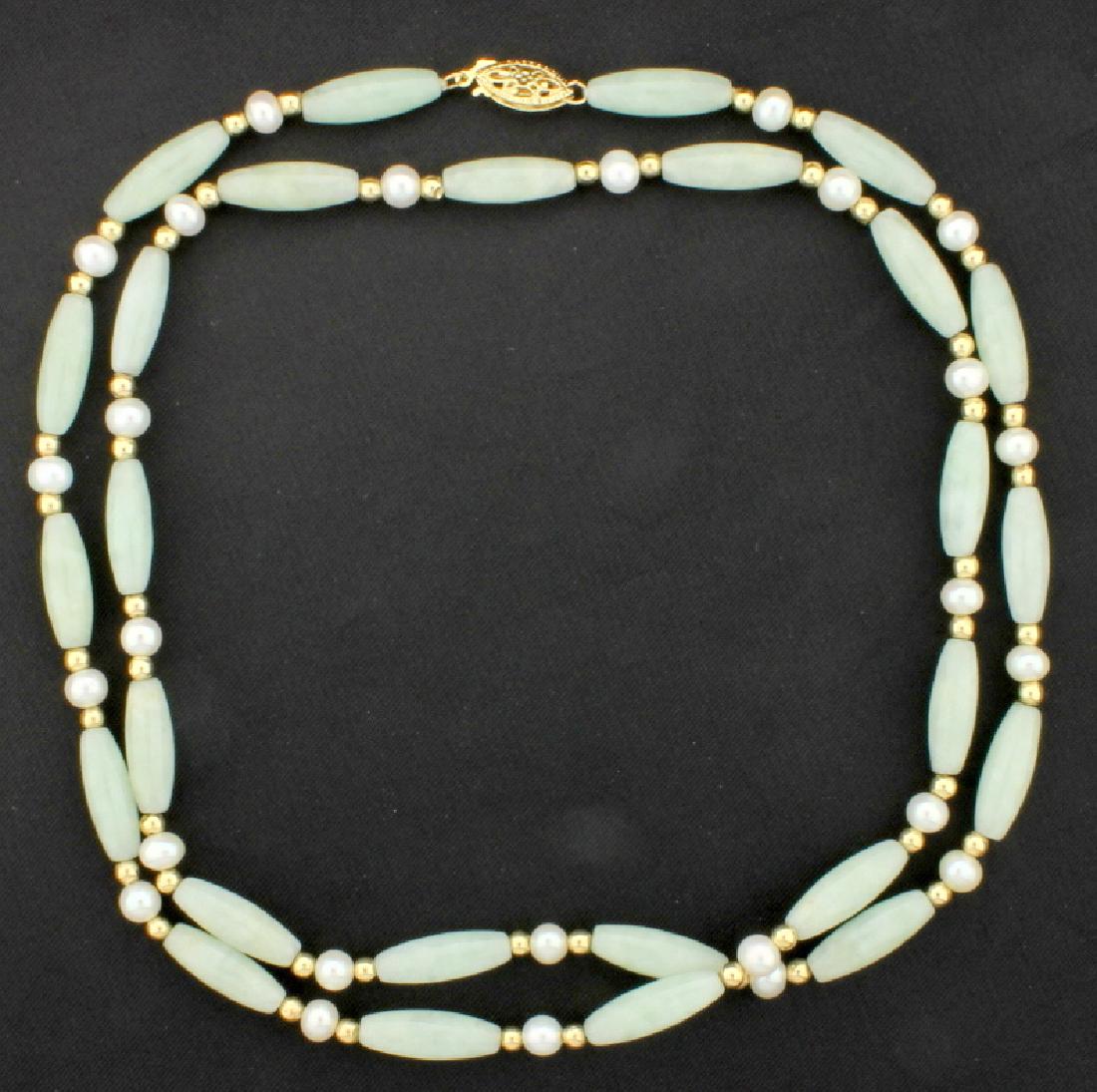 26 1/2 Inch Jade & Pearl Necklace: With a 14K yellow gold clasp and spacer balls. There are twenty eight 5mm pearls and twenty seven 15x5mm tubular shaped beautiful jade gemstones. 24.6g