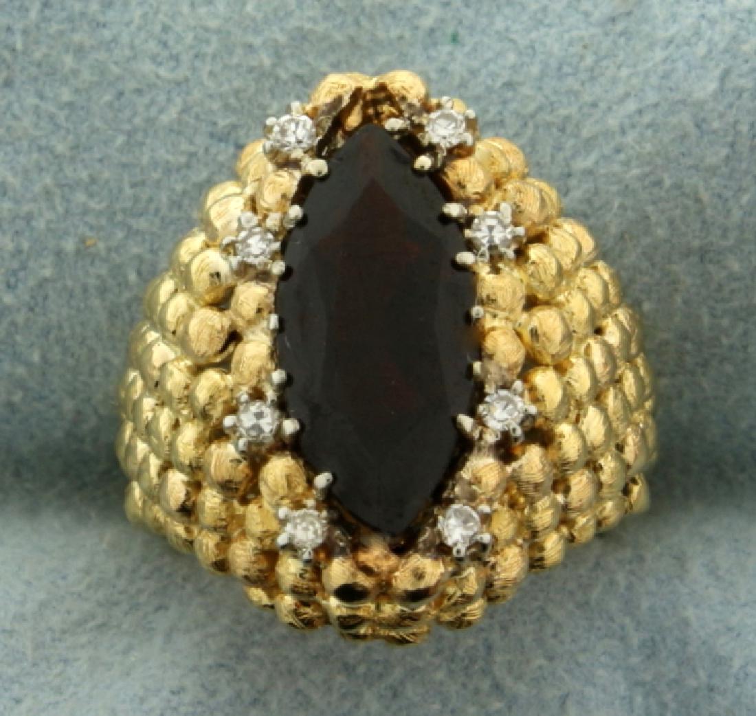 Custom Designed Vintage Garnet and Diamond Ring: In 14k yellow gold. Contains 15x7mm natural garnet with deep red color and excellent clarity. Also contains eight .02ct very high quality diamonds of VS clarity/F color. Size 4 1/2. 11.4g.