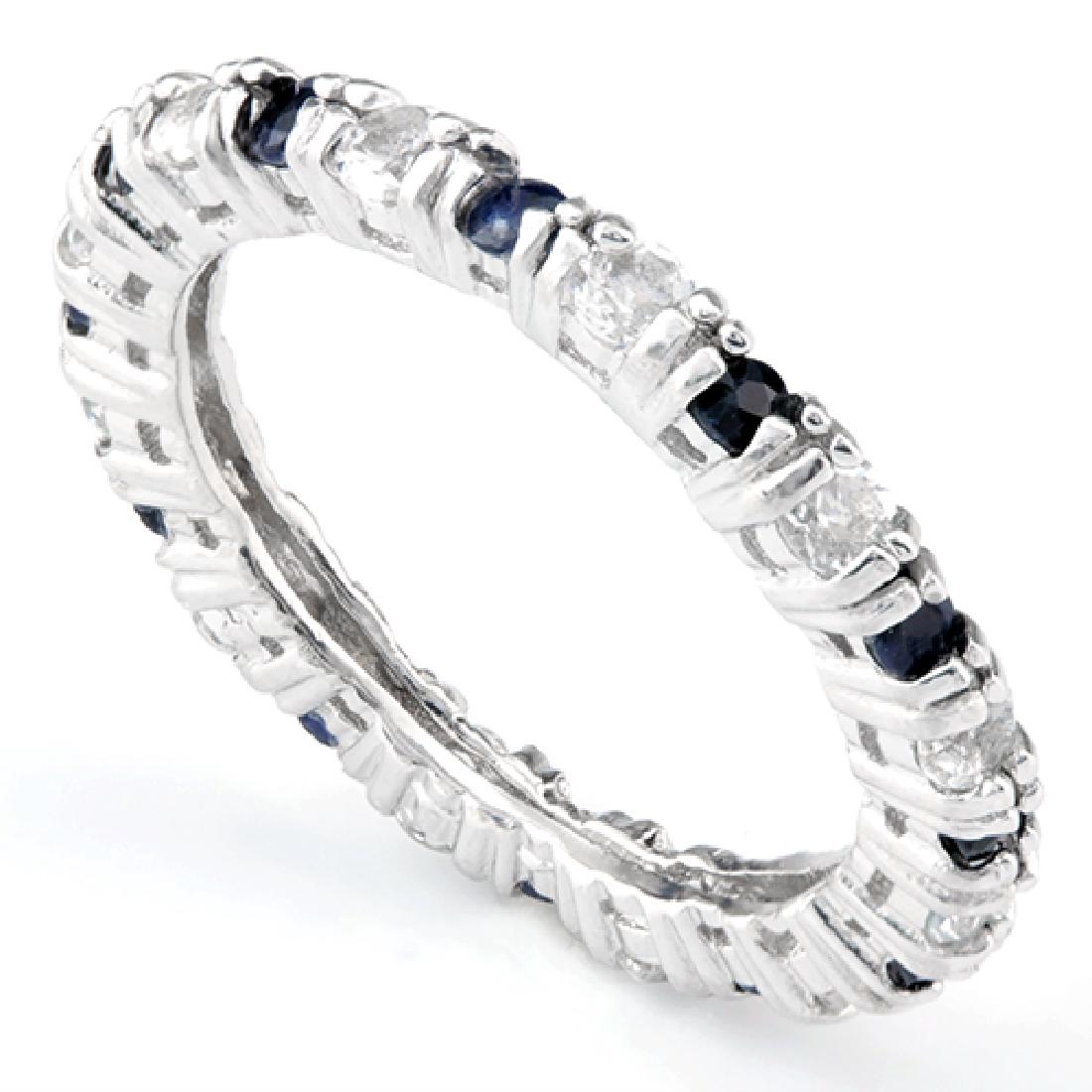 Sapphire and White Topaz Stackable Ring in Sterling: Stacking rings are so fun! This ring contains alternating genuine Midnight Blue Sapphire and White Topaz gemstones set in Platinum over Sterling Silver. The gems go completely around in a circle, and