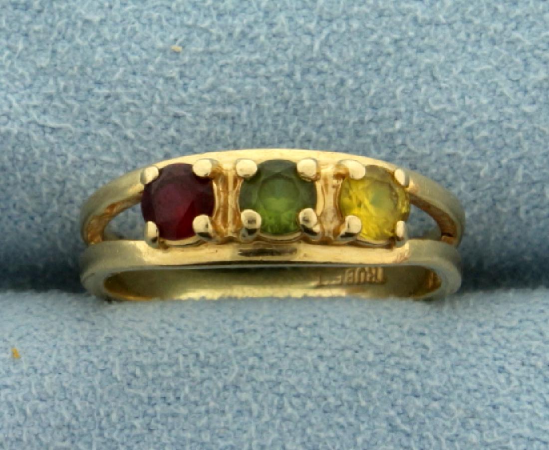 Garnet, Peridot, and Citrine Ring: In 10k yellow gold, containing 3.5mm each of garnet, peridot, and citrine gemstones. Size 5. 2.1g.