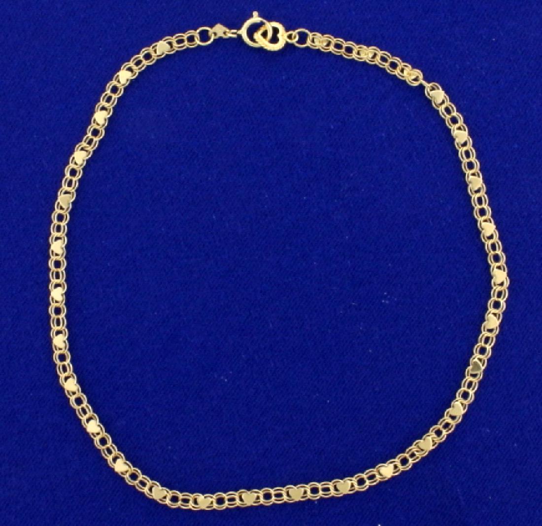 10 1/4 Inch Heart Anklet in 14k Gold: In 14k yellow gold, 10 1/4 inch long and 3mm wide. 2.7g.