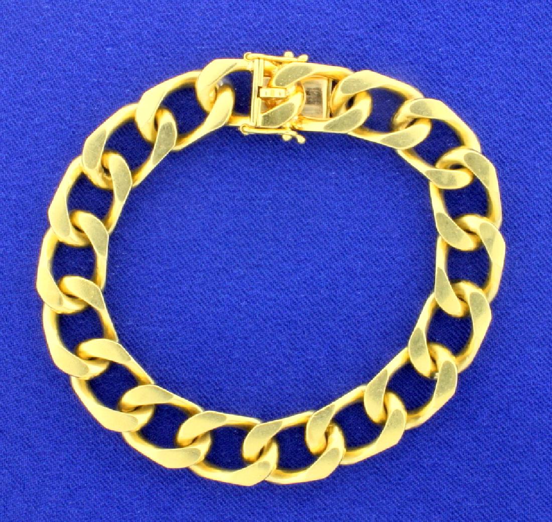 Heavy Flat Curb Link Chain Bracelet: In 14K yellow gold it is 7 1/4 inches long and 10.25mm wide. Has double safety clasps. 56.6g