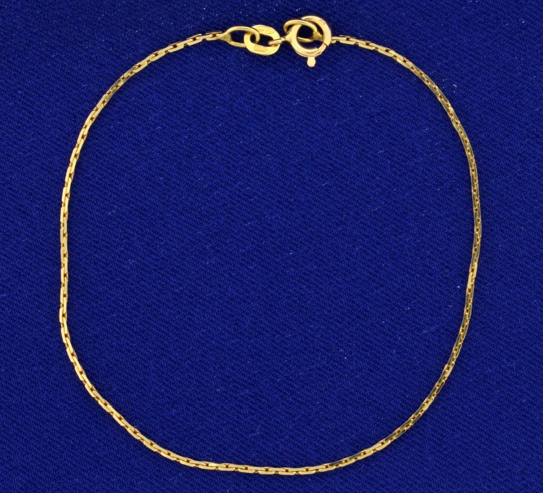 7 1/4 Inch Chain Link Bracelet: In 14k yellow gold, 7 1/4 inch long and .8mm thick. 1.4g.