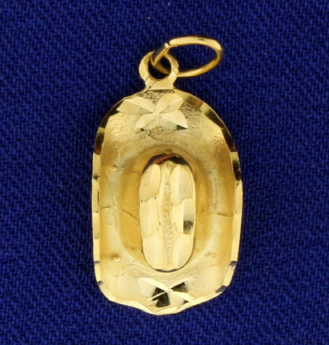 Cowboy Hat Pendant/Charm: In 14k yellow gold. 1" long with bale. 2.6g.