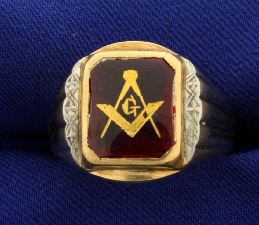 Masonic Ring: In 10k yellow and white gold. 11x9mm red crystal with mason symbol printed on it. Size 9 1/2. 6.5g.