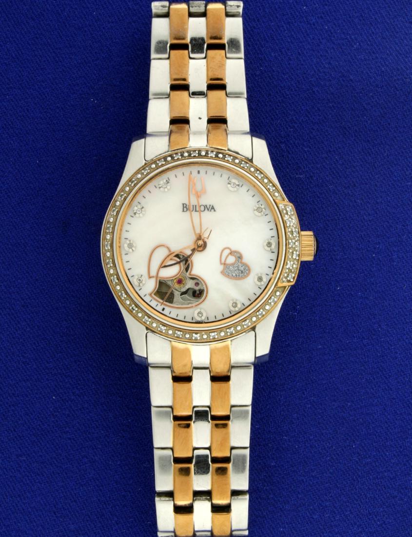 Bulova Ladies 21 Jewel Automatic Diamond Watch: In stainless steel. Watch has diamonds surrounding bezel as well as on Mother of Pearl face. Great two tone rose gold color and stainless steel. Movement runs great. One small scratch on crystal, mini