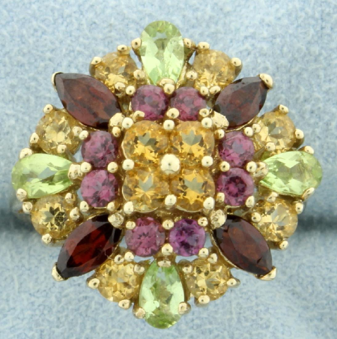 5.5 ct TW Multi Colored Gemstone Ring: In 10K yellow gold. This ring contains four 5x3mm pear shaped peridots, four 6x3mm marquise garnets, twelve 3.5mm round citrines & eight 2.5mm round pink topaz gemstone. For a total weight of 5.5cts, 