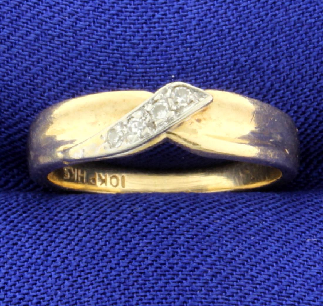 Unique Style Diamond Band Ring: In 10K yellow gold. Contains .07 ct. TW of high quality diamonds,, SI clarity/H color. Size 5 1/2. 2.5g