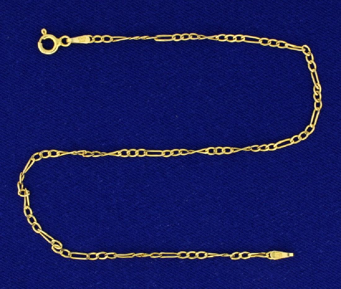 Italian Made 9 1/2 Inch Figaro Link Anklet: In 14k yellow gold. 2mm wide and 9 1/2" long. 0.9g.