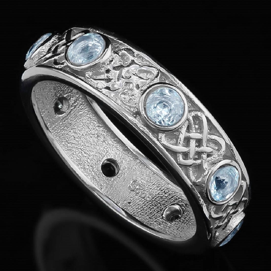 Aquamarine Vintage Style Eternity Band Ring in Sterling: Genuine 0.64ctw Aquamarine gemstones are set in a 5.5mm wide band with a vintage design that goes around the entire ring. This ring can be stacked with other rings or worn on its own. Size 7. 3.7g