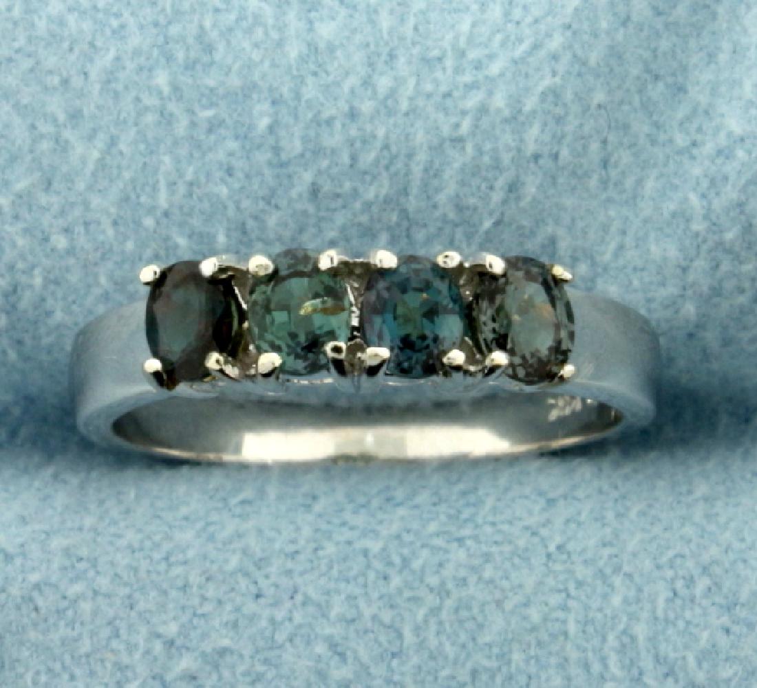 Color Changing Alexandrite Ring in 14k White Gold: In 14k white gold. Contains four natural 4x3mm Alexandrite color changing gemstones that turn from Green to Red depending on light source. Size 7. 3.4g.