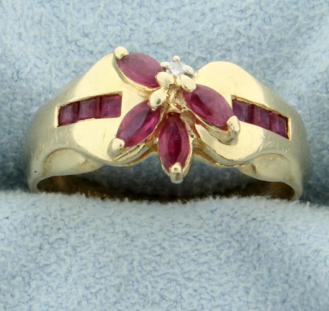 3/4 ct TW Ruby and Diamond Ring: In 14K yellow gold. This ring contains four 4x2mm marquise and six 2mm square ruby gemstones. Also there is one .01ct round diamond. Size 6 1/2 3.1g
