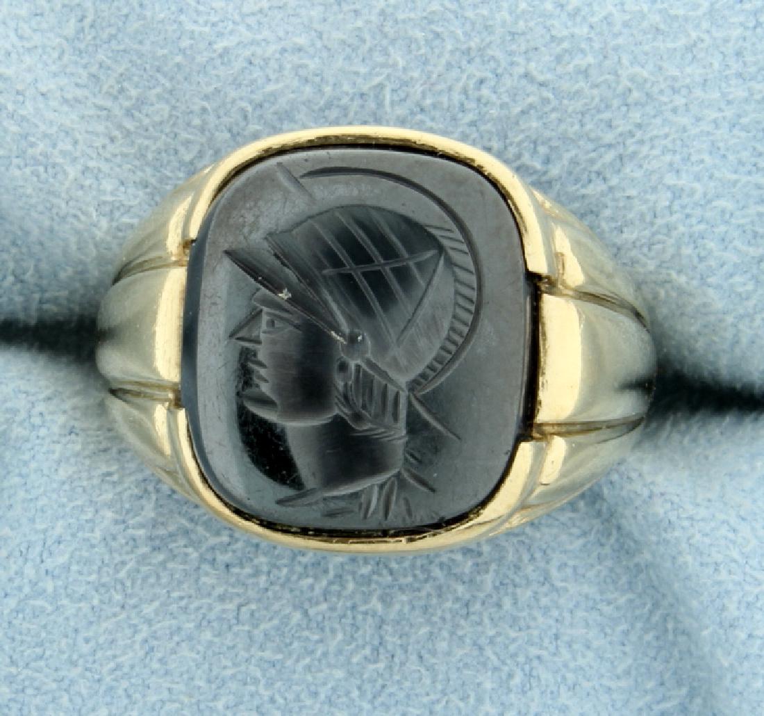 Carved Hematite Gladiator Signet Ring: In 10K yellow gold. The signet is 15x14mm, and the ring is a size 11 1/2 7.4g