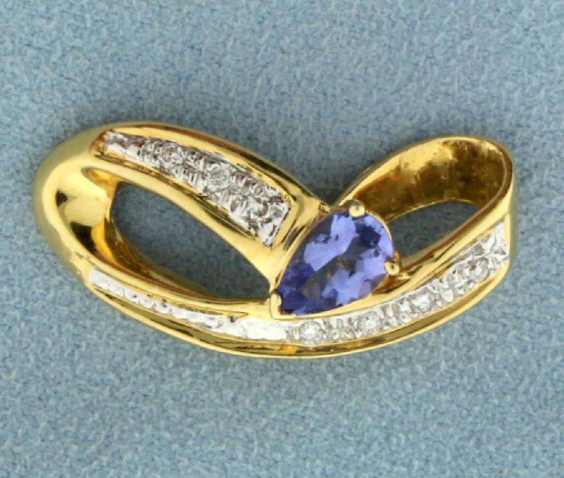 Tanzanite and Diamond Slide: Fantastic 14k yellow gold slide for an omega or neck chain. Contains 7 brilliant cut high quality diamonds, 0.15 ct TW and a pear shaped Tanzanite, 8mm x 5mm, that has an approximate weight of 1 carat