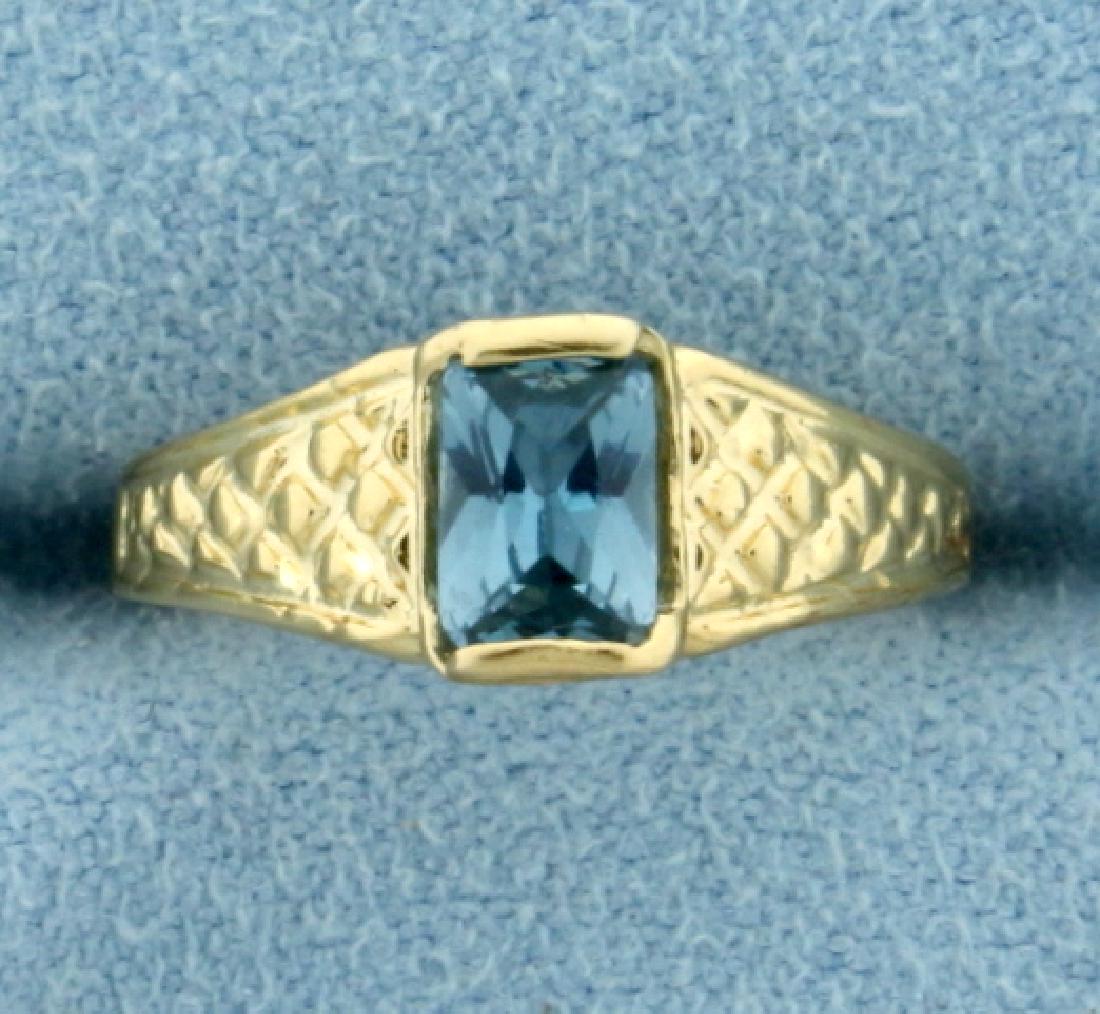 Antique Blue Spinel Ring in 14K Yellow Gold: In 14K Yellow Gold. Contains a natural 6x4mm emerald cut natural blue spinel gemstone with bright light blue color and excellent clarity. Size 4 1/2. 1.3g