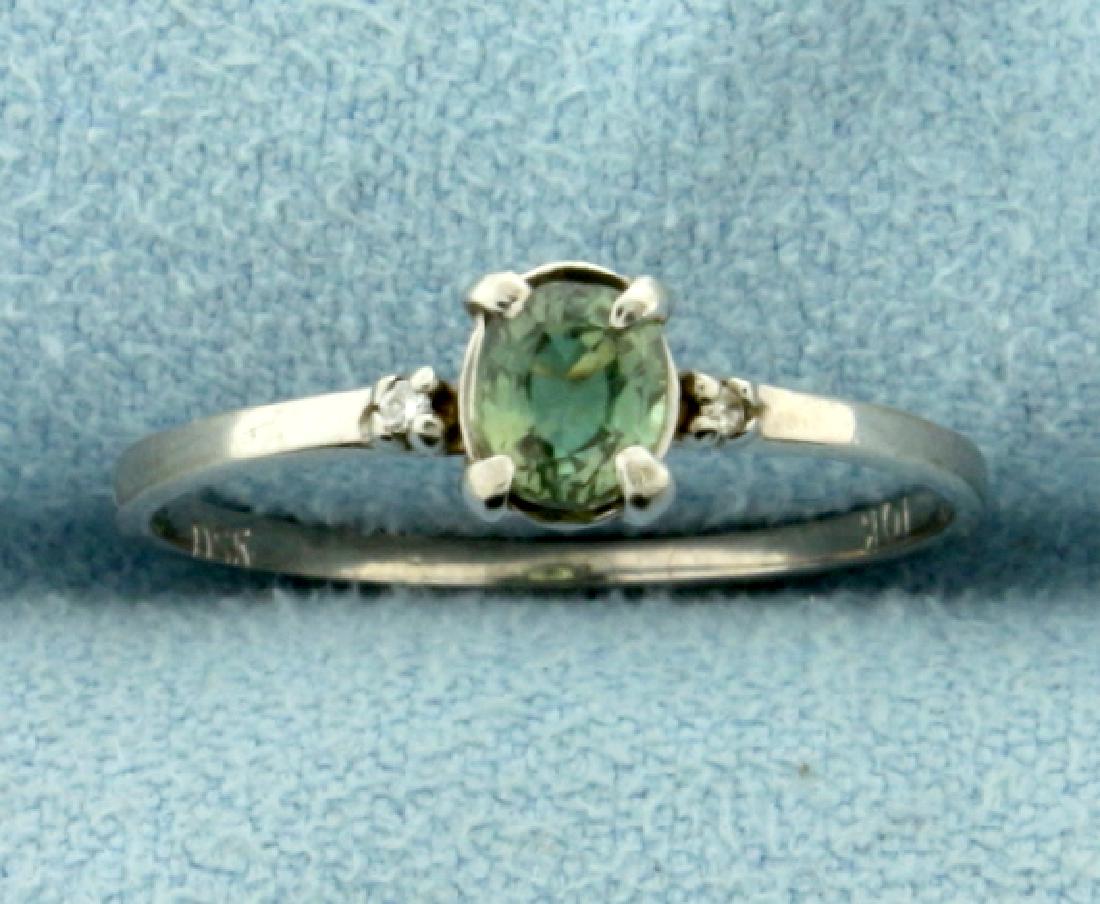 Solitaire Color Changing Alexandrite Ring in 10K White: In 10K White Gold. Contains a high quality 1/4ct oval color changing Alexandrite that changes from green to purple depending on lighting. Size 6. 0.9g