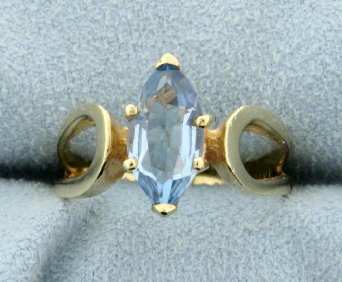 2 ct Blue Topaz Ring: In 14k yellow gold this ring has a 6x10mm marquise cut blue topaz. Size 7 1/2 3.1g