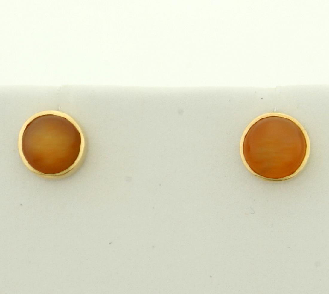 Cats Eye Earrings in 14K Yellow Gold: In 14K Yellow Gold. Each earring contains a 6mm Cats Eye gemstone with very distinct and crisp "eye." No backs. 0.9g