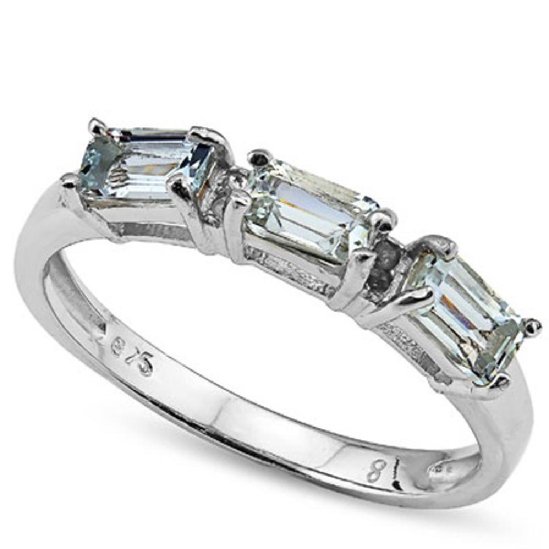 Aquamarine and Diamond Stacking Ring in Sterling Silver: Awesome 3/4 CTW genuine Aquamarine emerald cut gemstones are set with 0.02 CTW genuine diamond accents in Platinum over sterling silver for added brilliance. Size 8. 1.5g