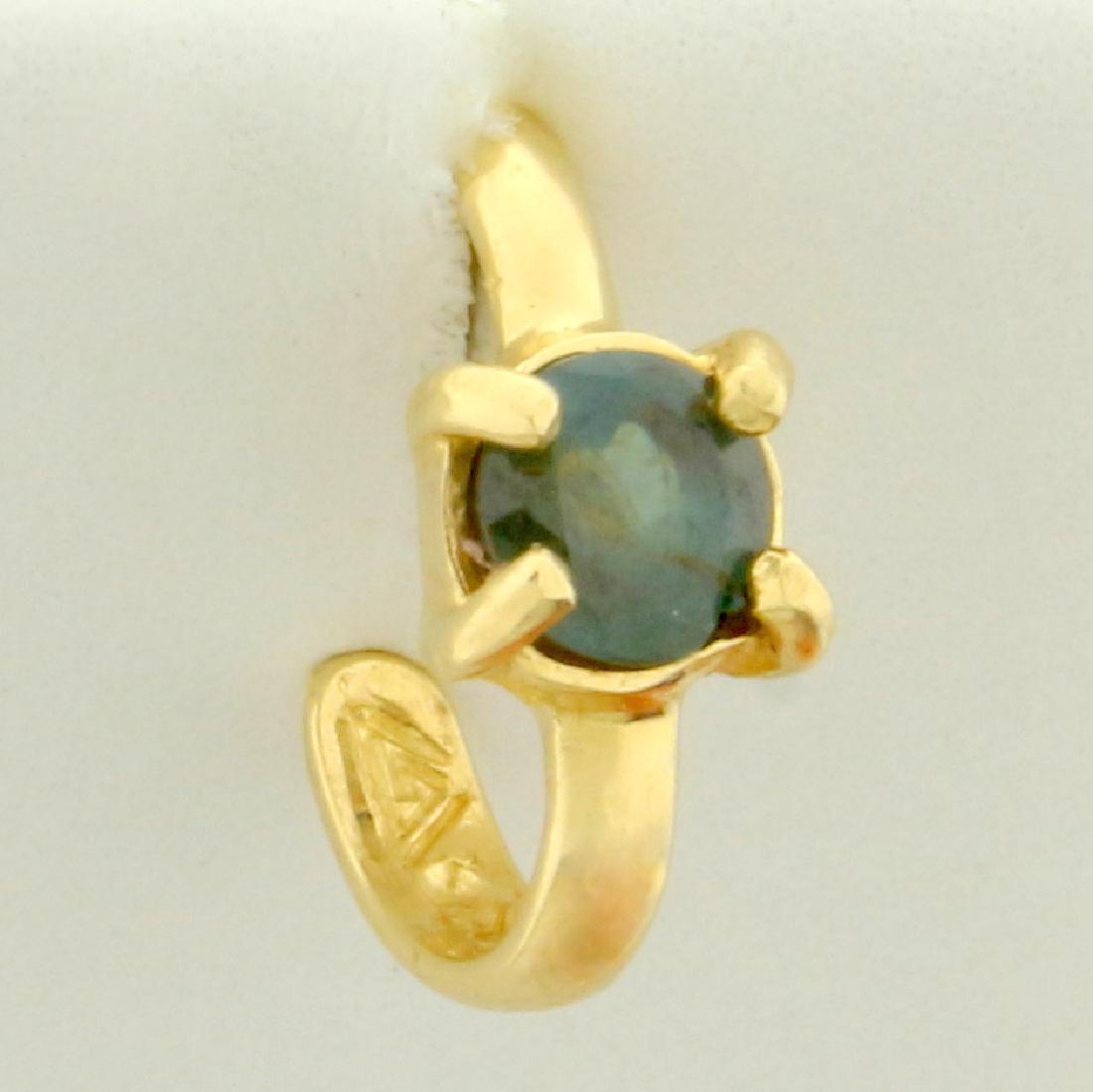 Alexandrite Ear Cuff in 14K Yellow Gold: In 14K Yellow Gold. Contains a natural color changing 3.5mm Alexandrite gemstone that changes from green to red depending on light source. 1/2" long. 0.5g