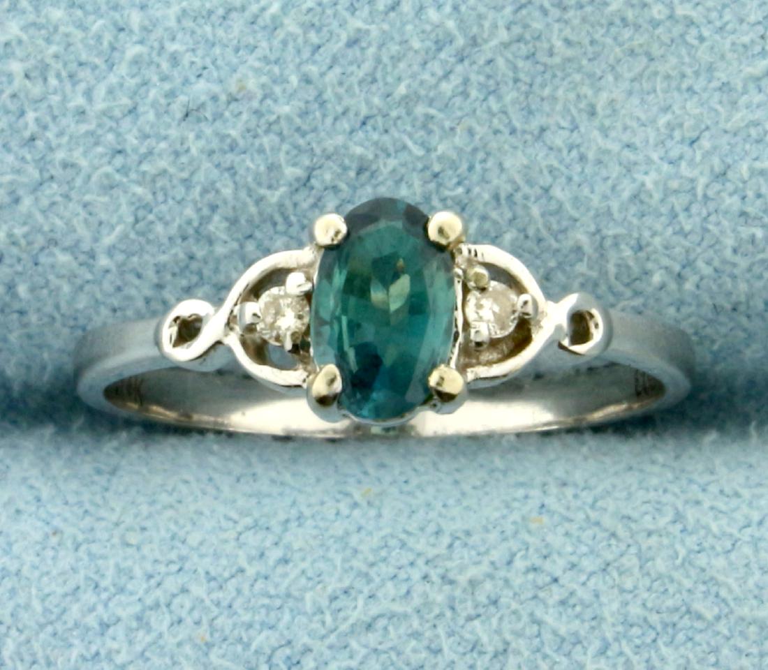 Alexandrite and Diamond Ring in 14K White Gold: In 14K White Gold. Contains a natural color changing 6x4mm Alexandrite gemstone and two high quality .01ct Diamonds, SI clarity/H color. Size 5 1/4. 1.3g