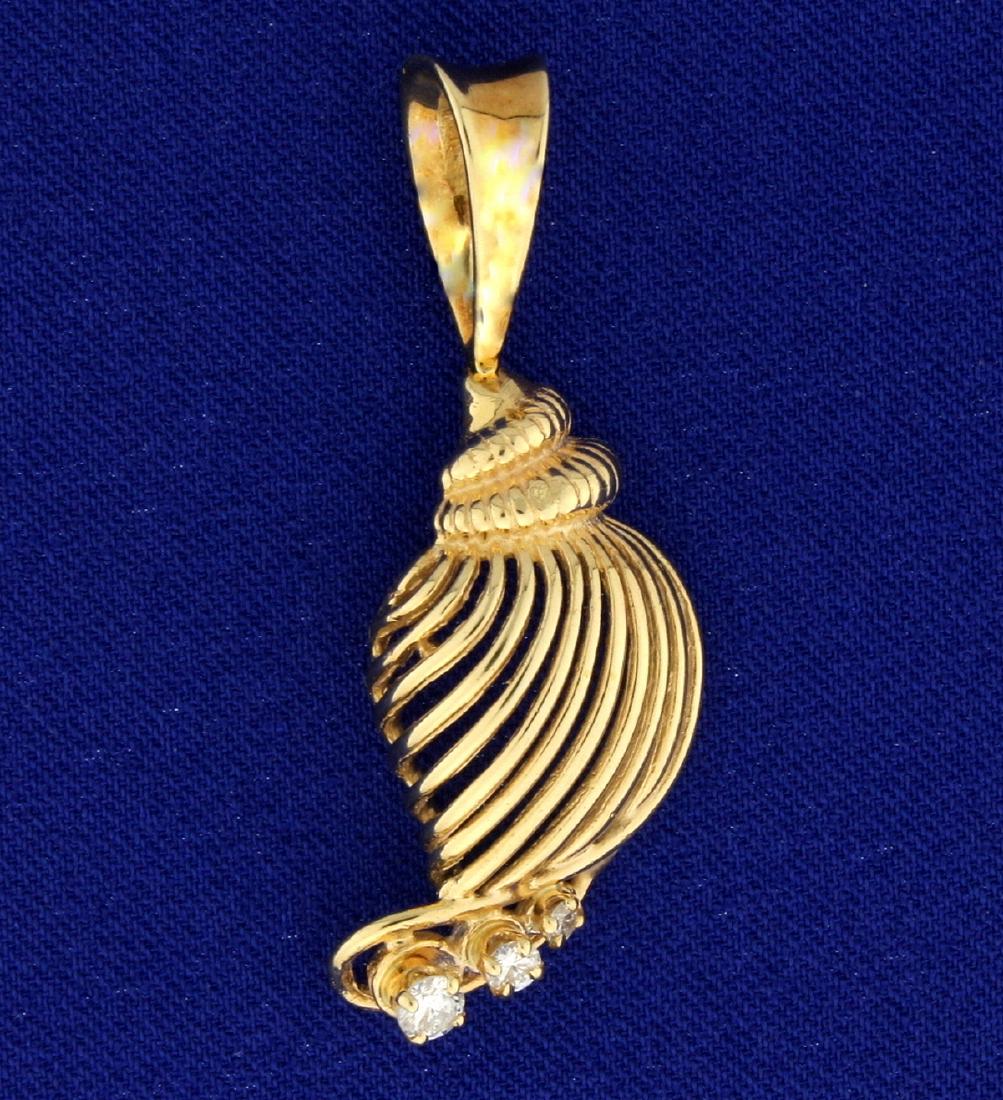 Diamond Seashell Pendant: In 14k yellow gold, contains 1/4ct TW of high quality diamonds of SI clarity/G color. 1 3/4" long. 5.9g.