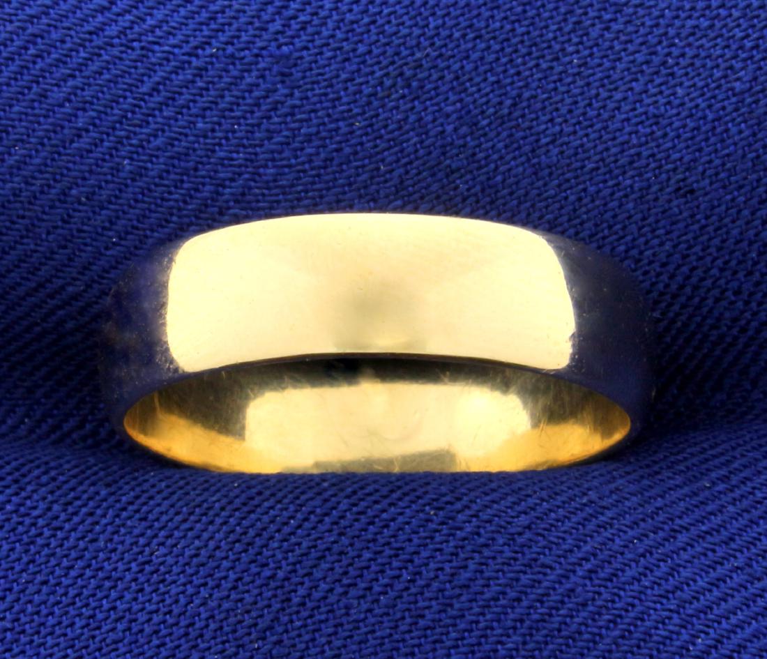 Wedding Band Ring in 14K Yellow Gold: In 14K Yellow Gold. 5.5mm wide. Size 9 3/4. 4.3g