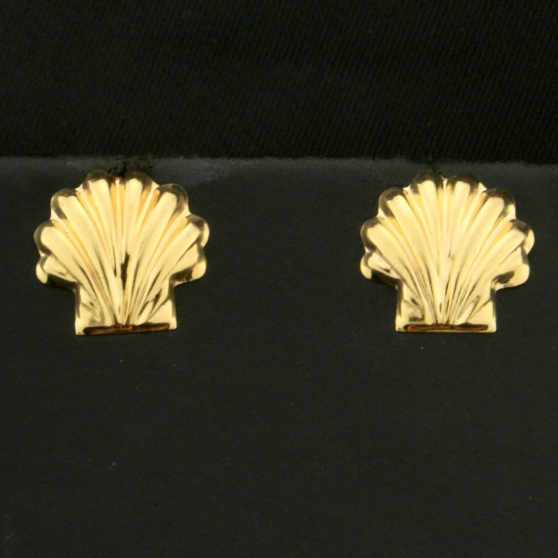Seashell Stud Earrings in 14K Yellow Gold: In 14K Yellow Gold. Seashells are 1/2 inch long. With friction backs. 0.5g