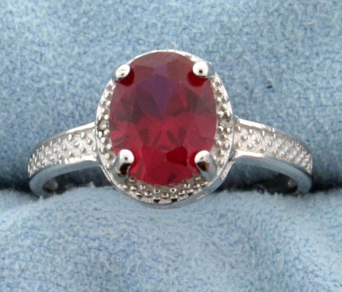 Lab Ruby Oval Cut 7x9MM and Diamond Ring Vintage Style: Classic genuine lab Ruby gemstone ring with 0.01ctw genuine Diamonds accenting the center stone set in Platinum over Sterling Silver, size 8. 2.4g