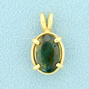 Natural 2.5ct Color Changing Alexandrite Pendant in 14K: In 14K Yellow Gold. Contains a natural 9x7mm oval shaped Alexandrite gemstone that changes color from green to red depending on light source. 3/4 inch long with bale. 1.7g