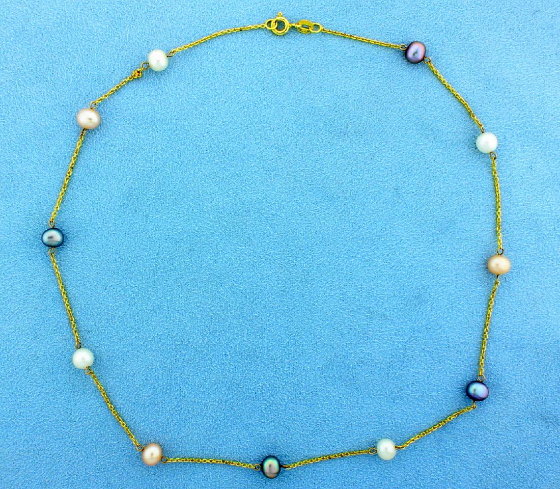 Emerald & Pearls Bells Christmas Holiday Pendant: In 14K yellow gold, the necklace is 15 1/2 inches long and contains eleven 6mm white, black and rose colored freshwater pearls with vibrant colors and excellent luster. 4.0g