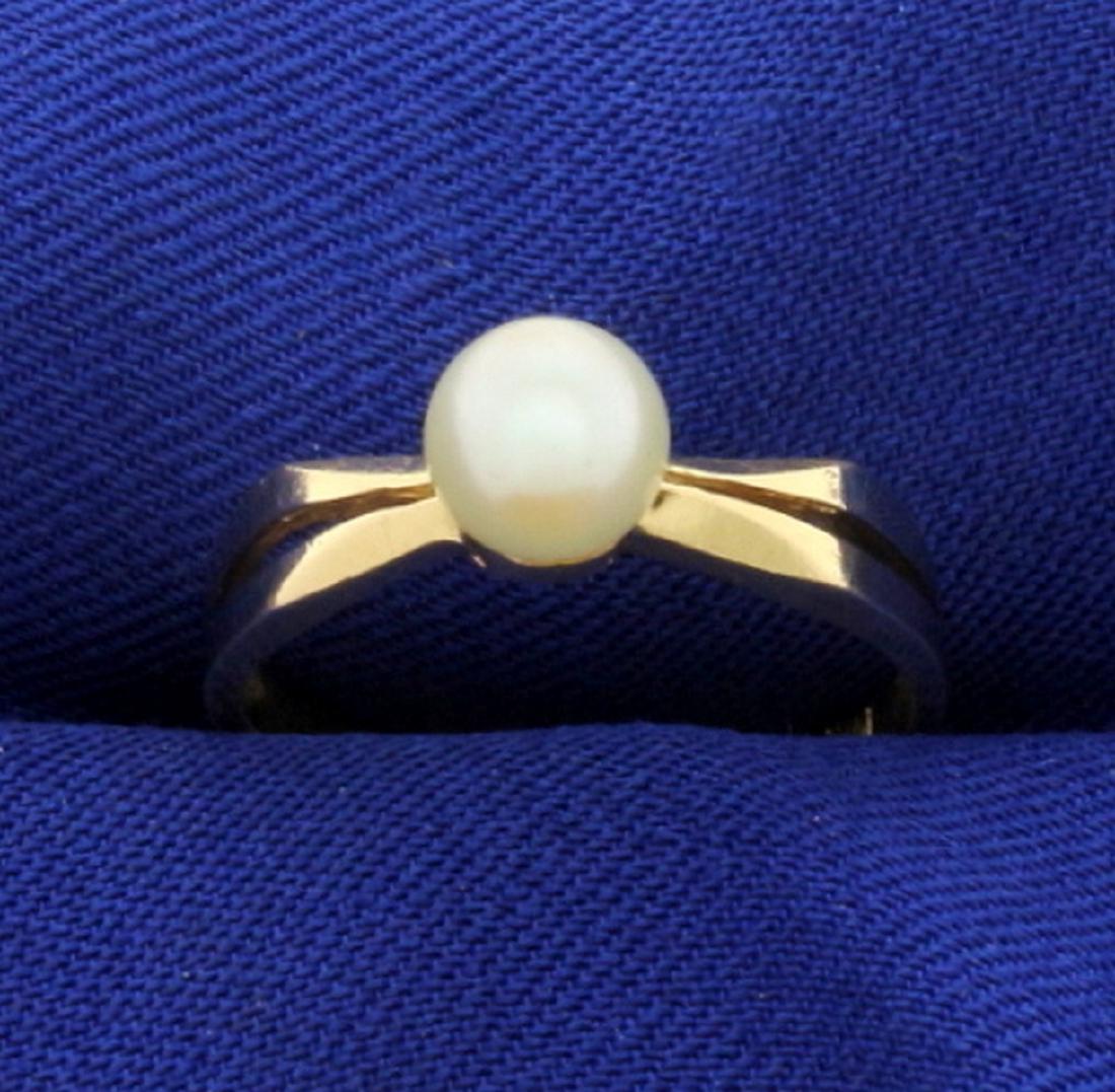 Solitaire Akoya Pearl Ring in 14k Gold: In 14k yellow gold. Contains a 6mm Akoya pearl with great color and luster. Size 6 1/2. 2.2g.