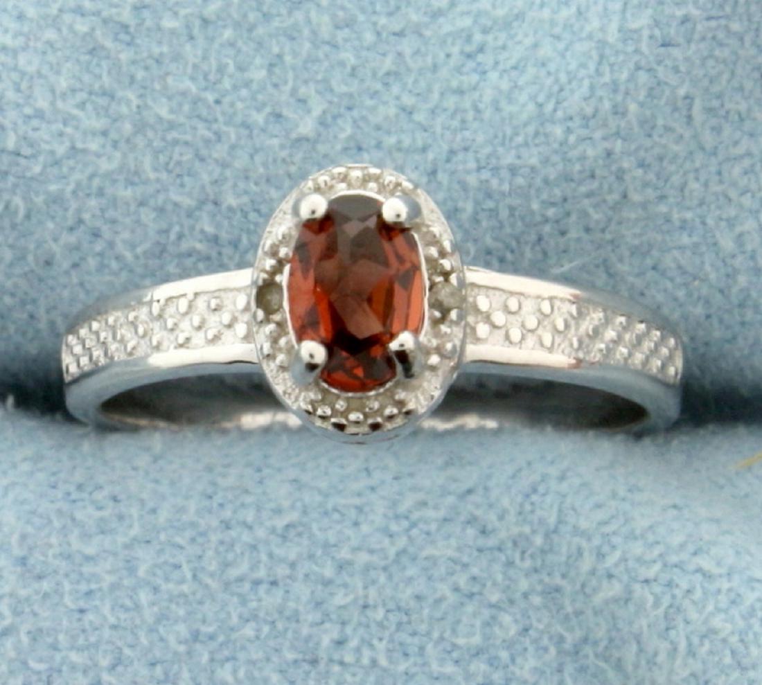 Garnet 0.5CT Ring with Diamonds in Sterling Silver: Approx. 1/2 carat genuine Garnet oval cut gemstone ring with 0.01ctw genuine Diamonds set in Platinum over Sterling Silver, size 7. 2.3g