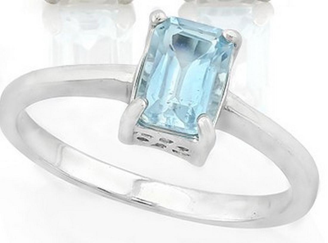 Sky Blue Topaz Emerald Cut Solitaire Ring in Sterling: 1.25CT Sky Blue Topaz emerald cut gemstone set in solitaire ring mounting. Mounting is Platinum over Sterling Silver. Size 7. 2.2g
