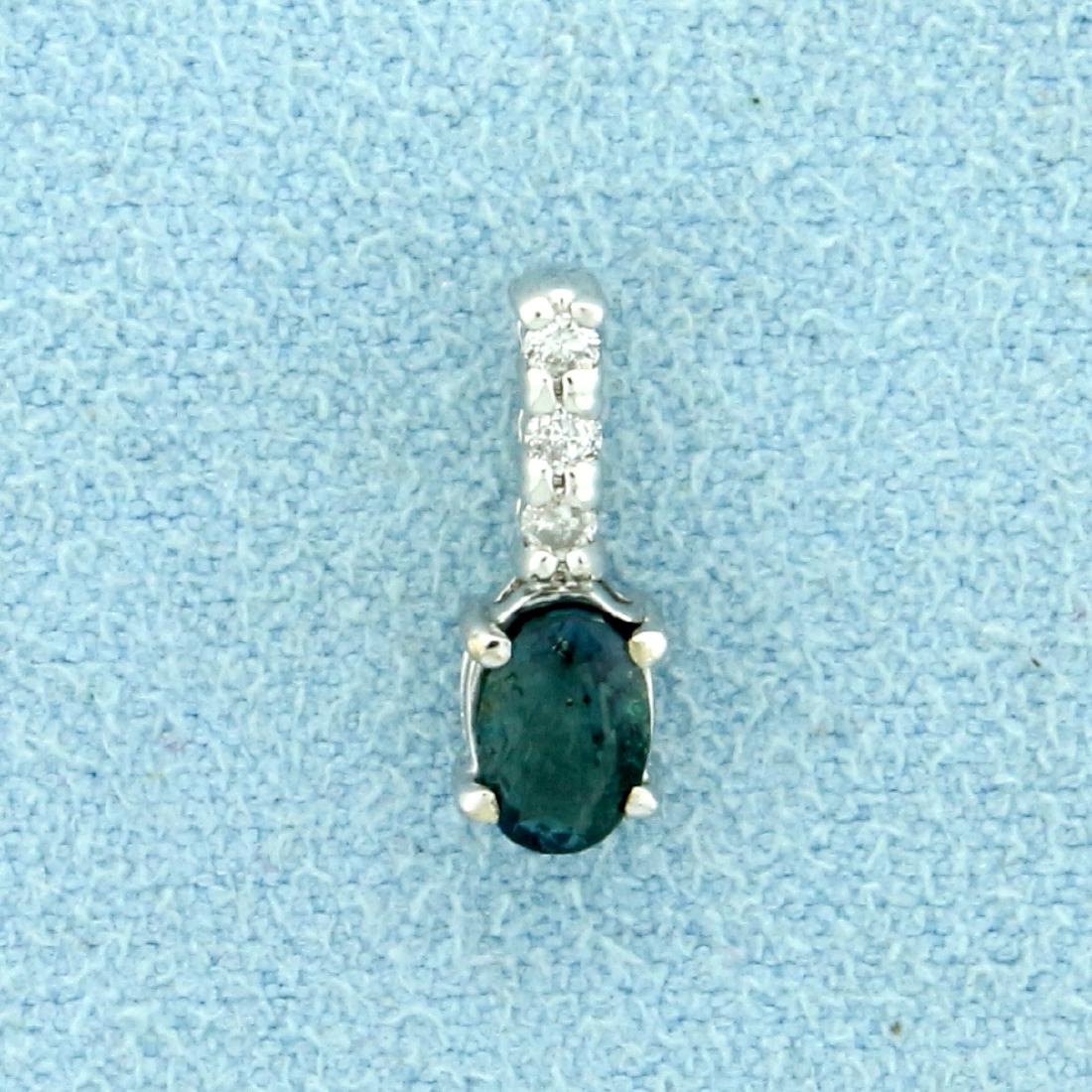 Alexandrite and Diamond Pendant in 10K White Gold: In 10K White Gold. Contains an oval 5.5x3.75mm color changing Alexandrite gemstone that changes from green to red depending on light source. Also contains three high quality .02ct Diamonds, SI clarity