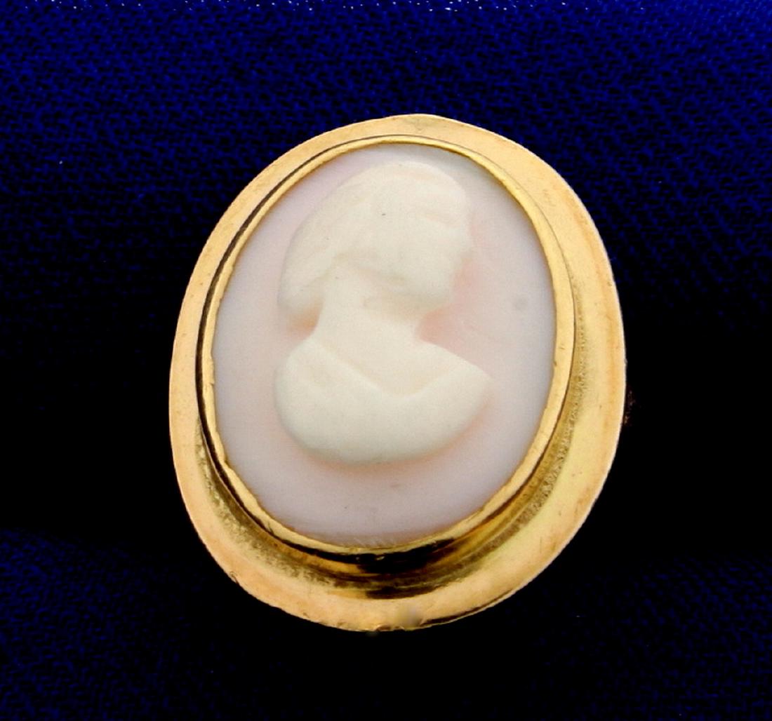 Antique Cameo Ring in 14K Yellow Gold: In 14K Yellow Gold. Contains a 16x12mm light pink Cameo. Size 4 1/2. 4.2g