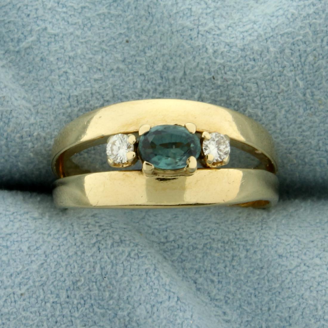 Natural Alexandrite and Diamond Ring in 14K Yellow Gold: In 14K Yellow Gold. Contains a high quality natural 5x3mm oval shaped color changing Alexandrite gemstone that changes from green to purple depending on light source. Also contains two high quality .0