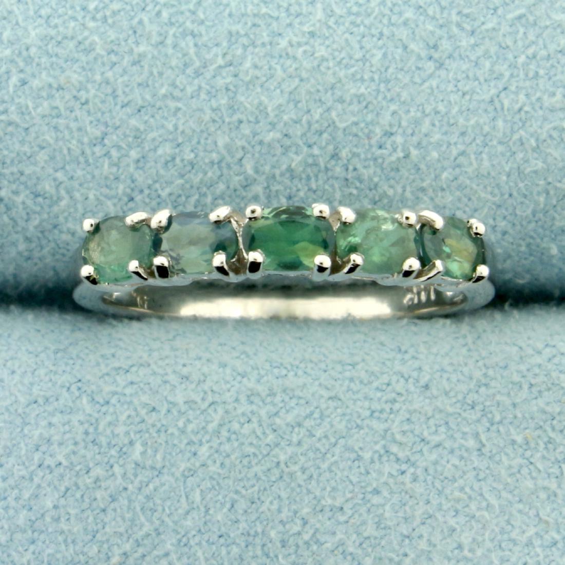 Natural Five Stone Alexandrite Ring in 14K White Gold: In 14K White Gold. Contains five 3x4mm oval shaped natural Alexandrite gemstones that change from green to purple depending on light source. Size 7. 2.4g