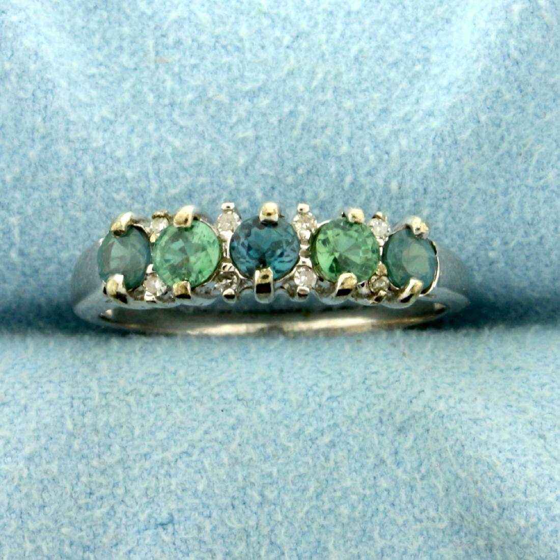 Lab Alexandrite and Diamond Band Ring in 10K White Gold: In 10K White Gold. Contains five 3.5mm lab round Alexandrite gemstones that change from green to purple depending on light conditions. Also contains eight high quality 1/2pt round Diamonds. Size 8. 2.